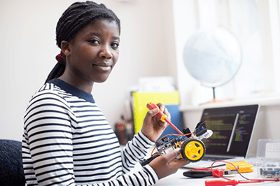 global-refuge-services-girl-working-on-model-car