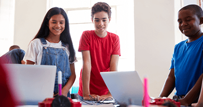 global-refuge-services-kids-looking-at-laptops